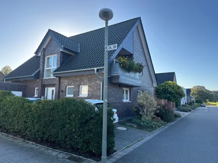 Ansicht - Wohnung kaufen in Steinfurt - Lichtdurchflutete 3-Zimmer-Wohnung mit Garten und Stellplatz in Steinfurt