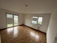 Wohnzimmer mit Balkon