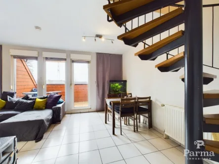 Wohnzimmer - Wohnung kaufen in Eschweiler - Charmante 3-Zimmer-Maisonettewohnung mit Balkon in Eschweiler-Dürwiß