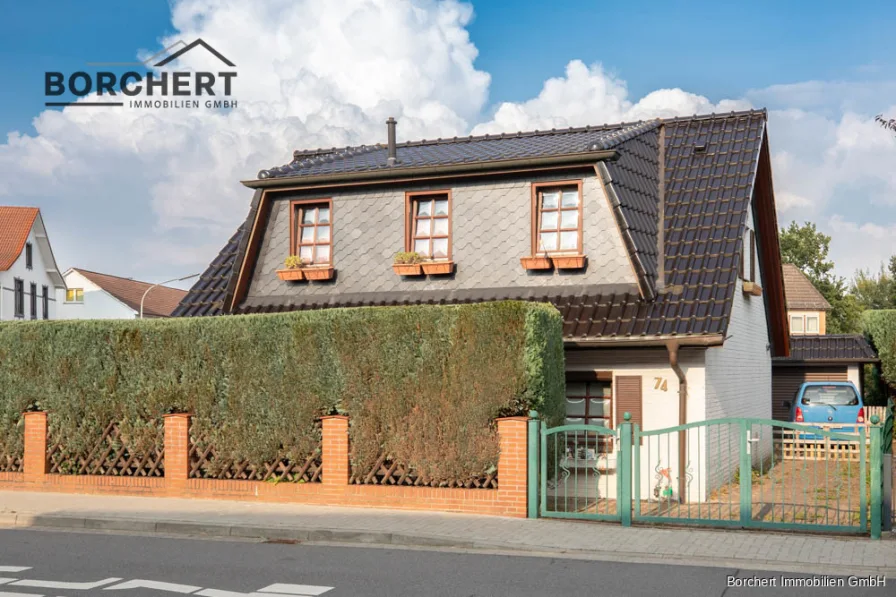 Titelbild - Haus kaufen in Ellerbek - Zentral gelegenes Haus mit lichtdurchflutetem Wintergarten in Ellerbek!