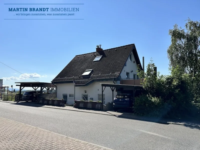  Hausansicht - Haus kaufen in Hünstetten-Kesselbach - Großzügiges Zweifamilienhaus mit Garten und Panoramablick in schöner Lage von Hünstetten-Kesselbach