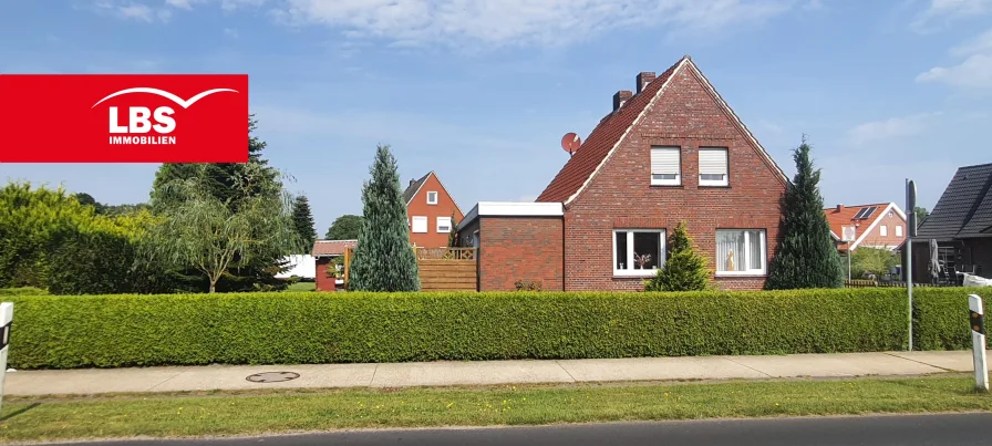 Straßenansicht  - Haus kaufen in Moormerland - Charmantes Einfamilienhaus in Moormerland- Warsingsfehn