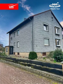 Außenansicht - Haus kaufen in Garbsen - Teilvermietetes Zweifamilienhaus in begehrter Lage von Garbsen.