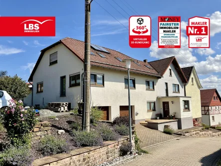 Hausansicht - Haus kaufen in Rohrberg - Familienfreundliches Zweifamilienhaus mit viel Platz und großem Garten