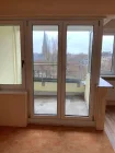 Wohnzimmer mit Balkon