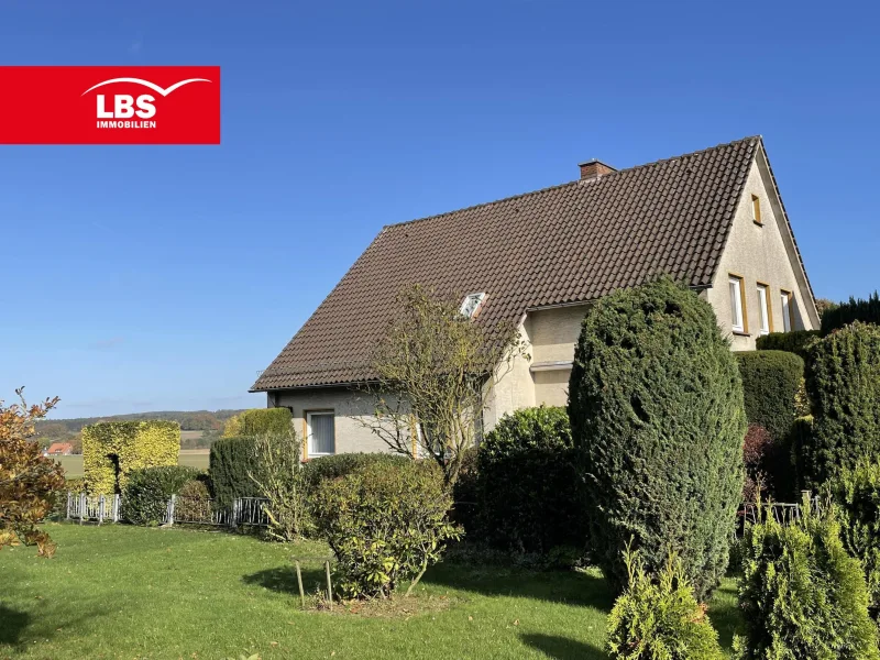 Vorderansicht - Haus kaufen in Melle - Wohnhaus mit wundervollem Blick ins Grüne