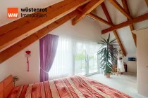 Schlafzimmer mit Balkonzugang