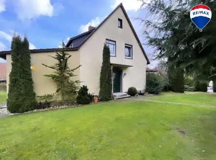 Außenansicht - Haus kaufen in Melle - Bezauberndes Ein-Zweifamilienhaus mit großem Garten in Melle zu verkaufen!