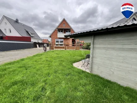 Gartenansicht - Haus kaufen in Stolzenau - Modernisiertes Einfamilienhaus mit großzügigem Grundstück in Stolzenau zu verkaufen!