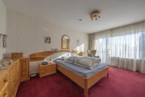 Schlafzimmer mit Balkonzugang