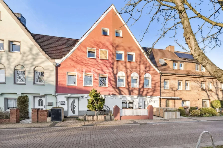 Außenansicht - Haus kaufen in Recklinghausen - Charmantes Reihenmittelhaus mit Garten, Kamin und Sauna – Ihr neues Zuhause mit Gestaltungspotenzial